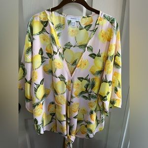 Summer flutter sleeve women’s top with front tie.